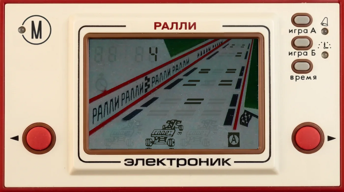 Rally on the classic LCD panel, a race car between the lane barriers